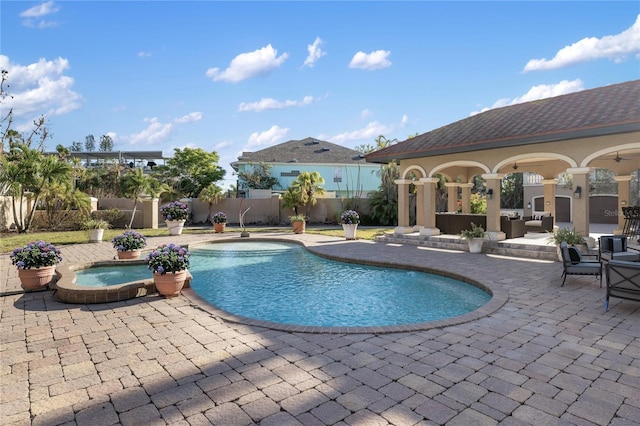 8855 Midnight Pass Rd, Sarasota, FL 34242 - view of pool featuring a patio, an outdoor hangout area, a fenced backyard, and a pool with connected hot tub