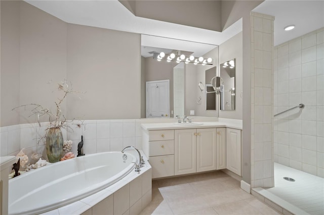 bathroom with separate shower and tub, vanity, and tile patterned flooring