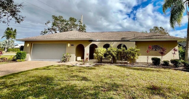 single story home with a front yard and a garage