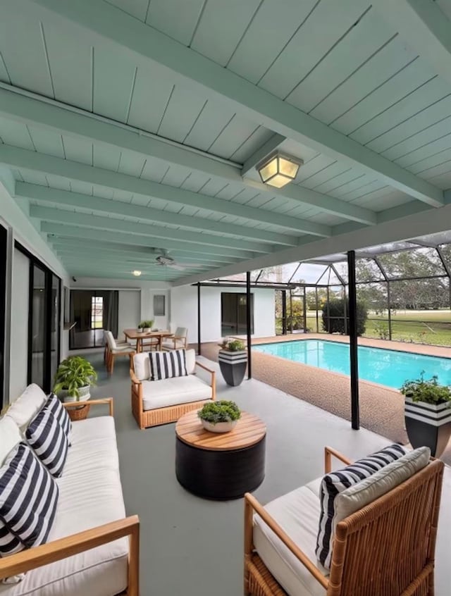 view of swimming pool featuring an outdoor living space, a lanai, a patio area, and ceiling fan