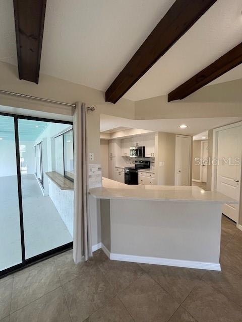 kitchen featuring white cabinetry, beam ceiling, kitchen peninsula, and black range with electric cooktop