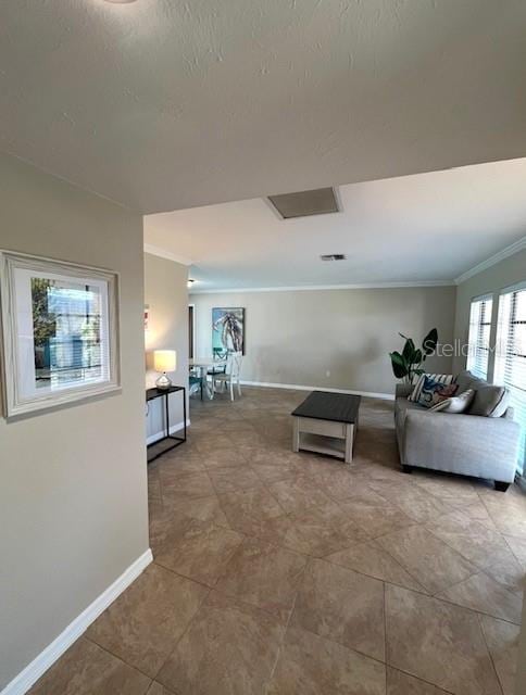 tiled living room with baseboards and crown molding