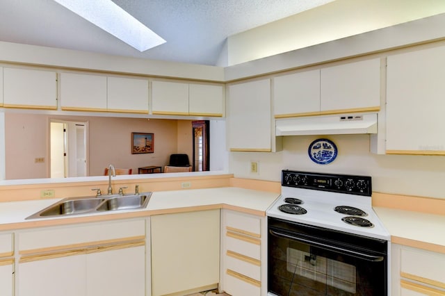 kitchen with white range with electric cooktop, sink, a skylight, a textured ceiling, and white cabinetry