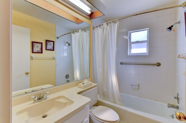 full bathroom with vanity, shower / bath combo, and toilet