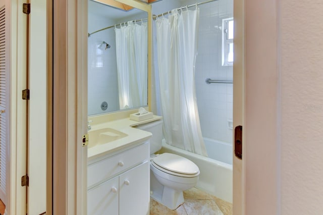 full bathroom featuring tile patterned flooring, vanity, shower / tub combo, and toilet