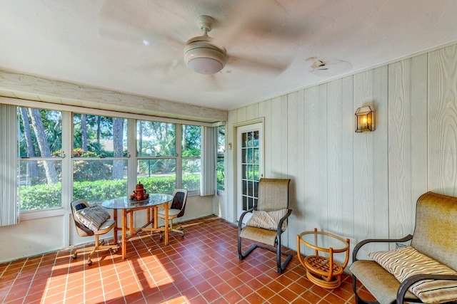 sunroom / solarium with ceiling fan