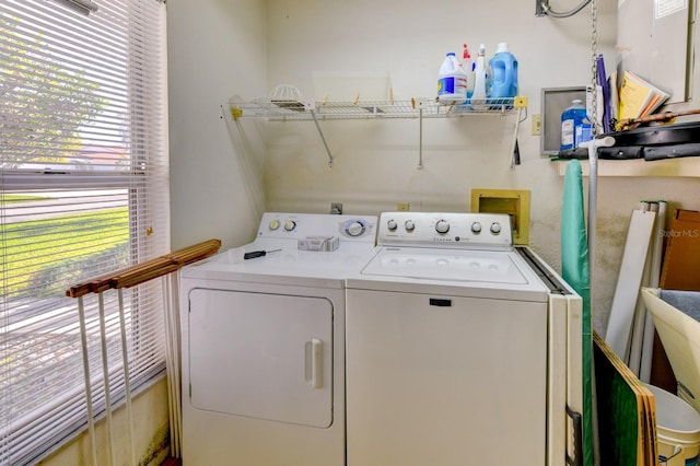 clothes washing area featuring washer and dryer