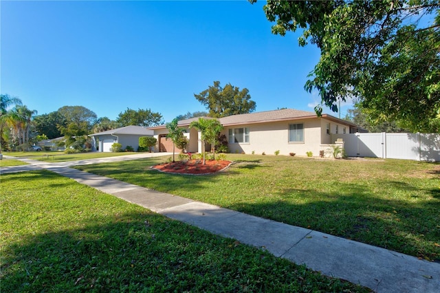 single story home with a front lawn