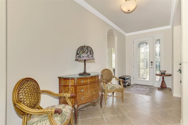 foyer with light tile patterned flooring and ornamental molding