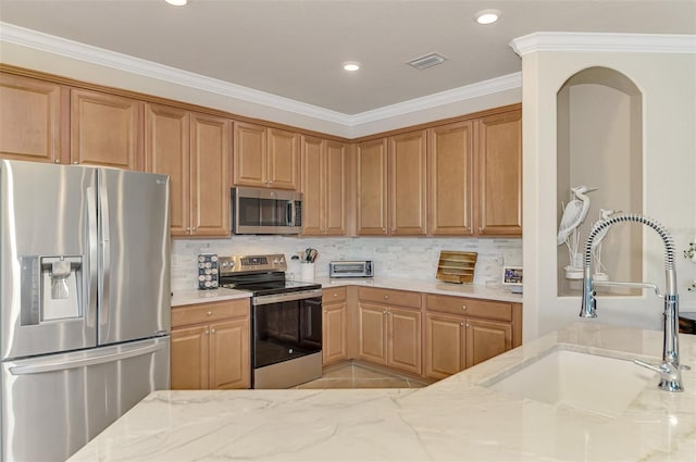 kitchen featuring crown molding, sink, light stone counters, and stainless steel appliances