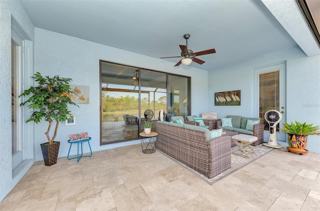 view of patio featuring an outdoor living space and ceiling fan