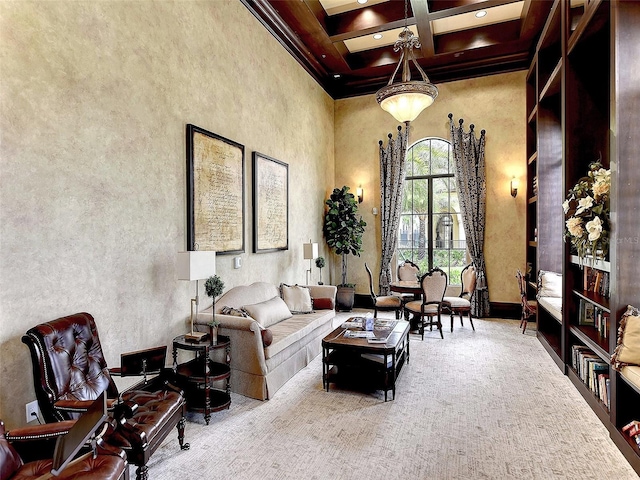 carpeted living room featuring beamed ceiling, a high ceiling, and coffered ceiling