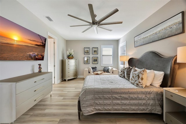 bedroom with ceiling fan and light wood-type flooring