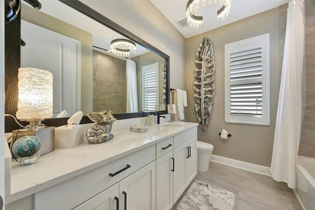 full bathroom featuring toilet, vanity, tile patterned floors, and shower / bathtub combination with curtain