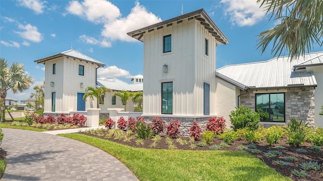 17744 Savory Mist Cir, Bradenton, FL 34211 - rear view of property featuring metal roof and stone siding