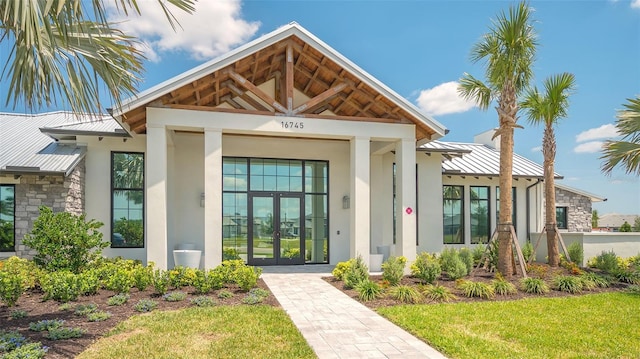 17744 Savory Mist Cir, Bradenton, FL 34211 - entrance to property with a standing seam roof, metal roof, french doors, and stucco siding