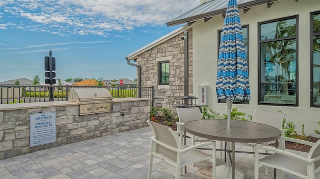 17744 Savory Mist Cir, Bradenton, FL 34211 - view of patio featuring fence, a grill, outdoor dining area, and area for grilling