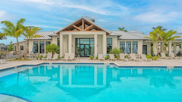 17744 Savory Mist Cir, Bradenton, FL 34211 - back of house featuring french doors, metal roof, a standing seam roof, and stucco siding