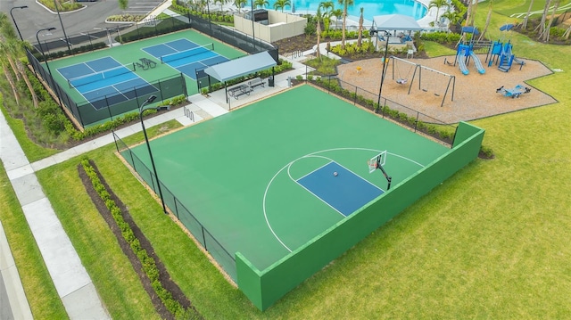17744 Savory Mist Cir, Bradenton, FL 34211 - view of sport court featuring a lawn, a tennis court, fence, playground community, and community basketball court