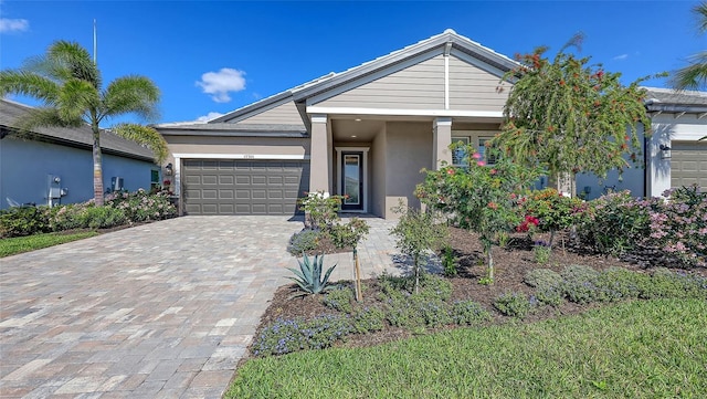 17744 Savory Mist Cir, Bradenton, FL 34211 - ranch-style home with a garage, stucco siding, and decorative driveway