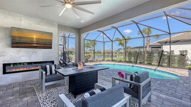 17744 Savory Mist Cir, Bradenton, FL 34211 - pool featuring a patio, ceiling fan, an outdoor living space with a fireplace, and glass enclosure