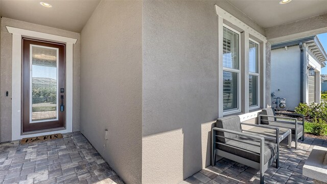 17744 Savory Mist Cir, Bradenton, FL 34211 - view of exterior entry with a porch and stucco siding