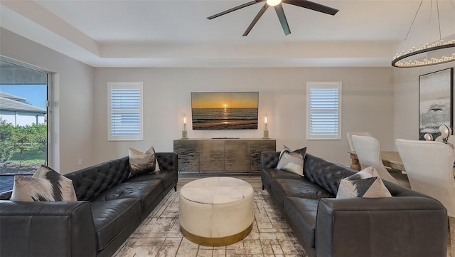 17744 Savory Mist Cir, Bradenton, FL 34211 - living area with a tray ceiling and a ceiling fan