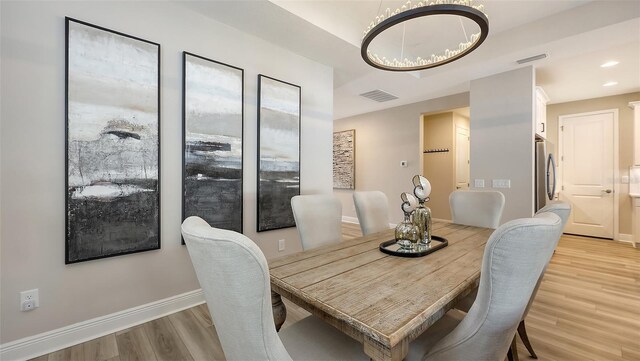 17744 Savory Mist Cir, Bradenton, FL 34211 - dining space with light wood-style floors, visible vents, recessed lighting, a chandelier, and baseboards