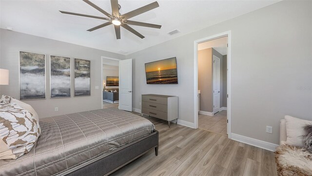 17744 Savory Mist Cir, Bradenton, FL 34211 - bedroom featuring wood finished floors, ceiling fan, baseboards, and visible vents