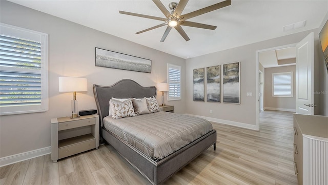 17744 Savory Mist Cir, Bradenton, FL 34211 - bedroom with visible vents, baseboards, light wood finished floors, and ceiling fan