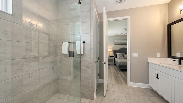 17744 Savory Mist Cir, Bradenton, FL 34211 - bathroom featuring a shower stall, vanity, ensuite bath, tile patterned floors, and baseboards