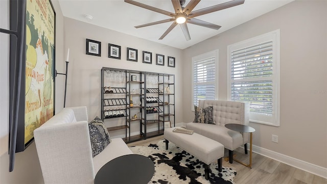 17744 Savory Mist Cir, Bradenton, FL 34211 - sitting room featuring wood finished floors, ceiling fan, and baseboards