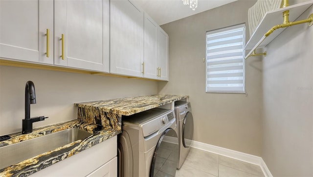 17744 Savory Mist Cir, Bradenton, FL 34211 - laundry area featuring baseboards, a sink, cabinet space, washing machine and clothes dryer, and light tile patterned flooring