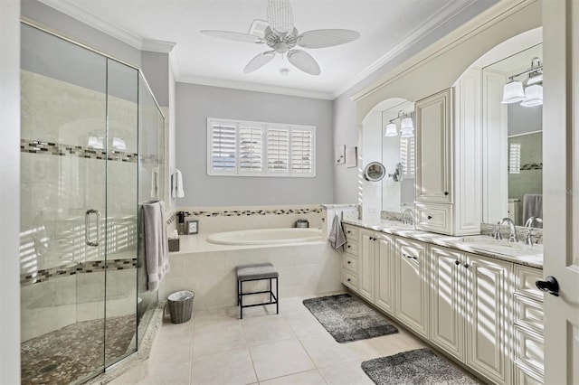 bathroom featuring tile patterned flooring, vanity, crown molding, and independent shower and bath