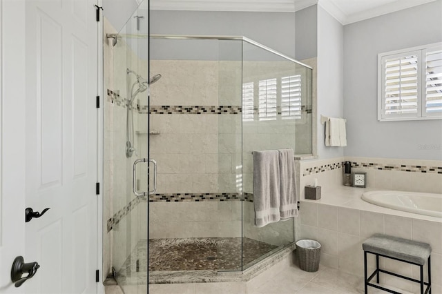 bathroom featuring shower with separate bathtub, tile patterned floors, and crown molding