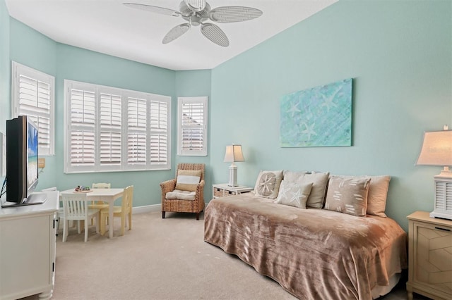 bedroom with light carpet and ceiling fan