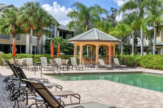 view of swimming pool with a gazebo and a patio area