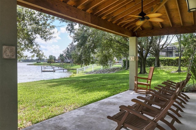 view of patio / terrace featuring a water view and ceiling fan