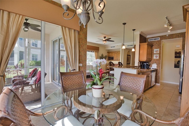 dining space featuring light tile patterned floors, ceiling fan with notable chandelier, ornamental molding, and sink