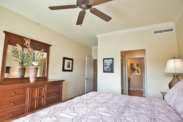 bedroom featuring ceiling fan, crown molding, and ensuite bathroom