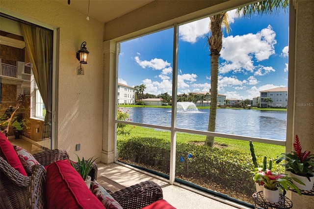 sunroom with a water view