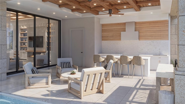 view of patio featuring ceiling fan and sink