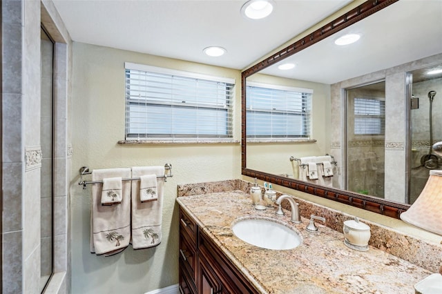 bathroom with vanity and walk in shower