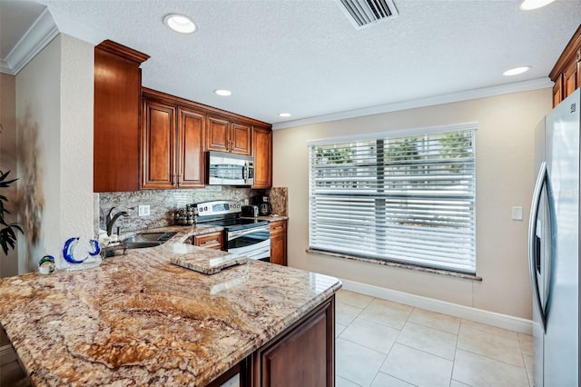 4430 Exeter Dr Unit M108, Longboat Key, FL 34228 - kitchen with appliances with stainless steel finishes, crown molding, a peninsula, light stone counters, and tasteful backsplash