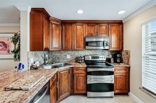 4430 Exeter Dr Unit M108, Longboat Key, FL 34228 - kitchen featuring appliances with stainless steel finishes, decorative backsplash, light tile patterned floors, ornamental molding, and brown cabinetry