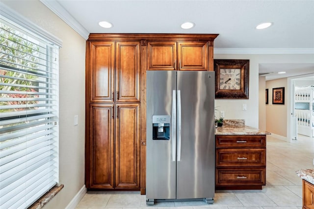 4430 Exeter Dr Unit M108, Longboat Key, FL 34228 - kitchen with stainless steel fridge with ice dispenser, ornamental molding, light stone countertops, light tile patterned floors, and recessed lighting