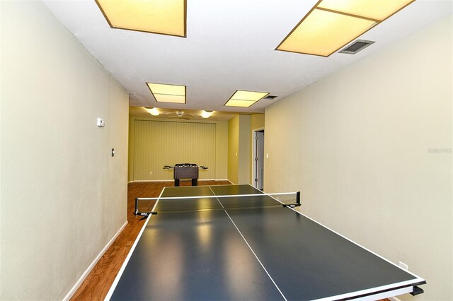 4430 Exeter Dr Unit M108, Longboat Key, FL 34228 - game room featuring dark wood-style floors and baseboards