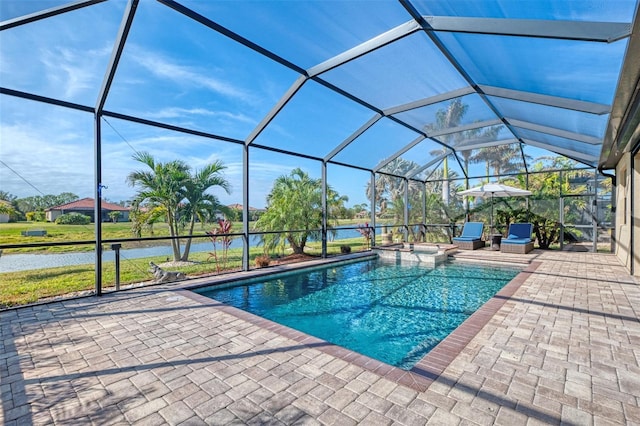 view of swimming pool featuring a water view, a lanai, a jacuzzi, and a patio area