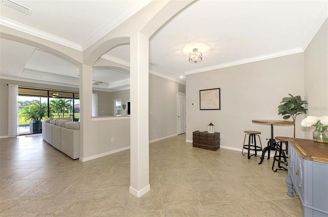 living room with a tray ceiling and crown molding