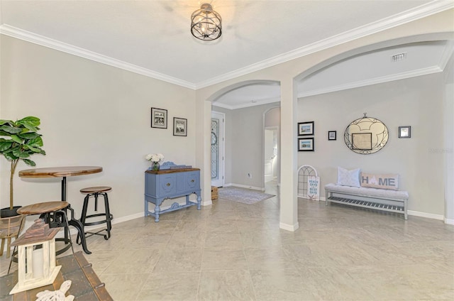 entryway featuring ornamental molding